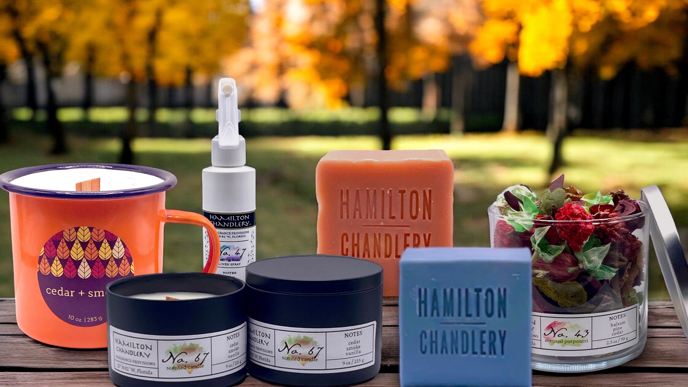 Hamilton Chandlery Fragrance Products on wooden table in Autumn Setting