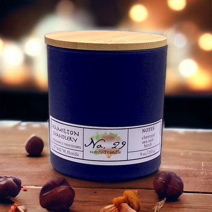 Fragrance No. 29 Blown Glass Candle with Roasting Chestnuts in Background | Hamilton Chandlery