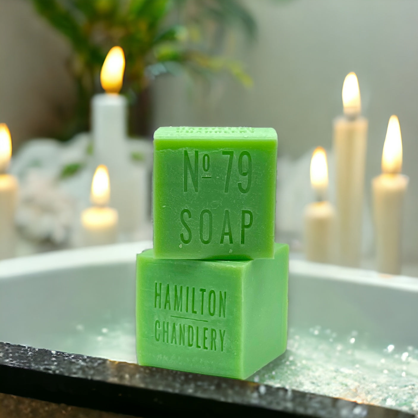 Fragrance No. 79 Sea Salt Soap  in Soapy Water with Candles in Background | Hamilton Chandlery