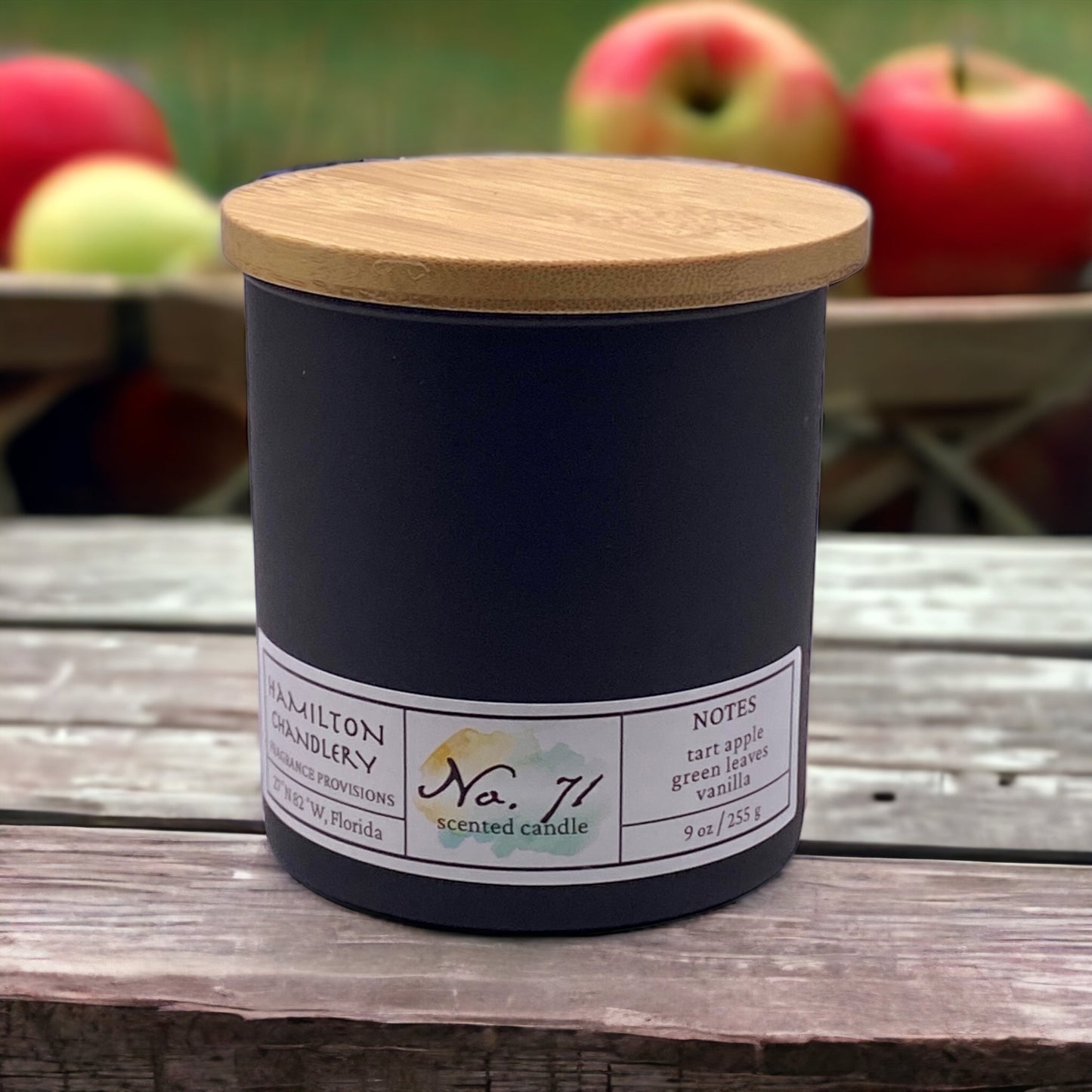 Fragrance No. 71 Blown Glass Candle on Rustic Table with Apple Harvest in Background | Hamilton Chandlery